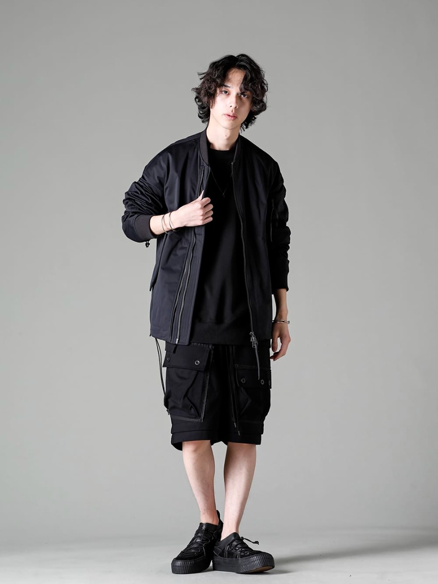 The Viridi-anne 2023SS スタイリング - A new water-repellent bomber jacket from The Viridi-anne 23 SS collection is the focal point, and many pieces of jewelry are combined for a spring-like look. Military based design but styling with an urban feel - VI-3558-06-Black - Water Repellent Bomber Jacket Black - VI-3590-01-Black - Sweat Shirt Black - VI-3607-04-Black - Jersey Short Pants Black 1-001