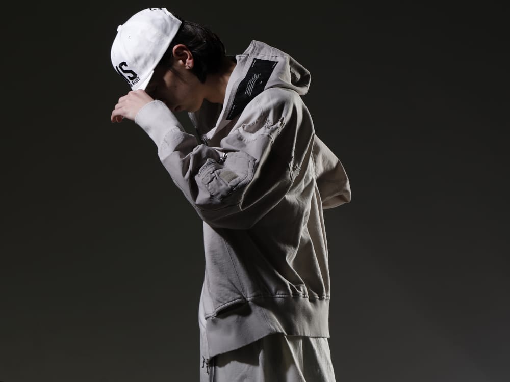 JULIUS / SAINT MICHAEL 2023SS - JULIUS hoodie with distinctive damaged finish. - 807CUM3-Plaster(Cotton Sweat Damaged Combo Hoodie Plaster) 817CPM3-Raw(Cotton/Modal Jersey Front Print Short Sleeve T-Shirt Raw) SM-S23-0000-072(PMS Cap) - 2-002